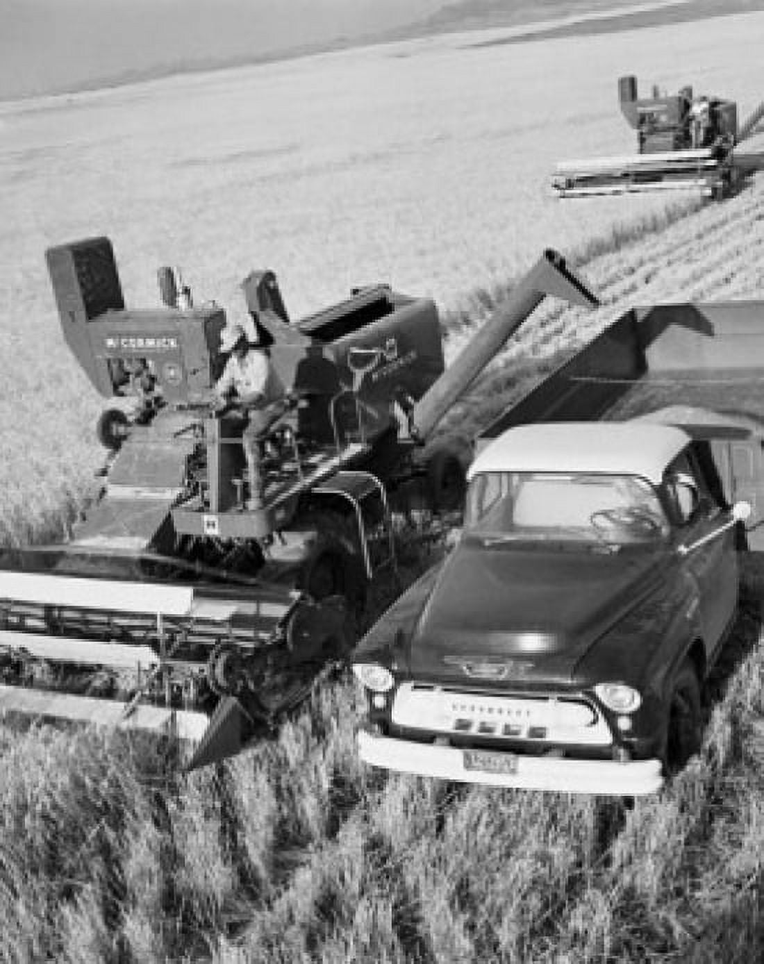 High angle view of a farmer using a combine harvester in a field Montana USA Canvas Art - (18 x 24)