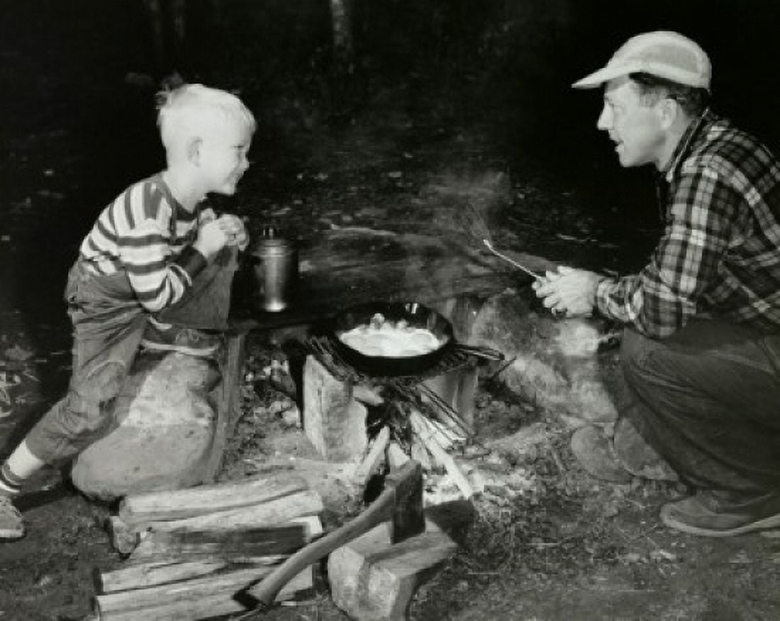 High angle view of a father and his son cooking on a camping trip Canvas Art - (24 x 36)
