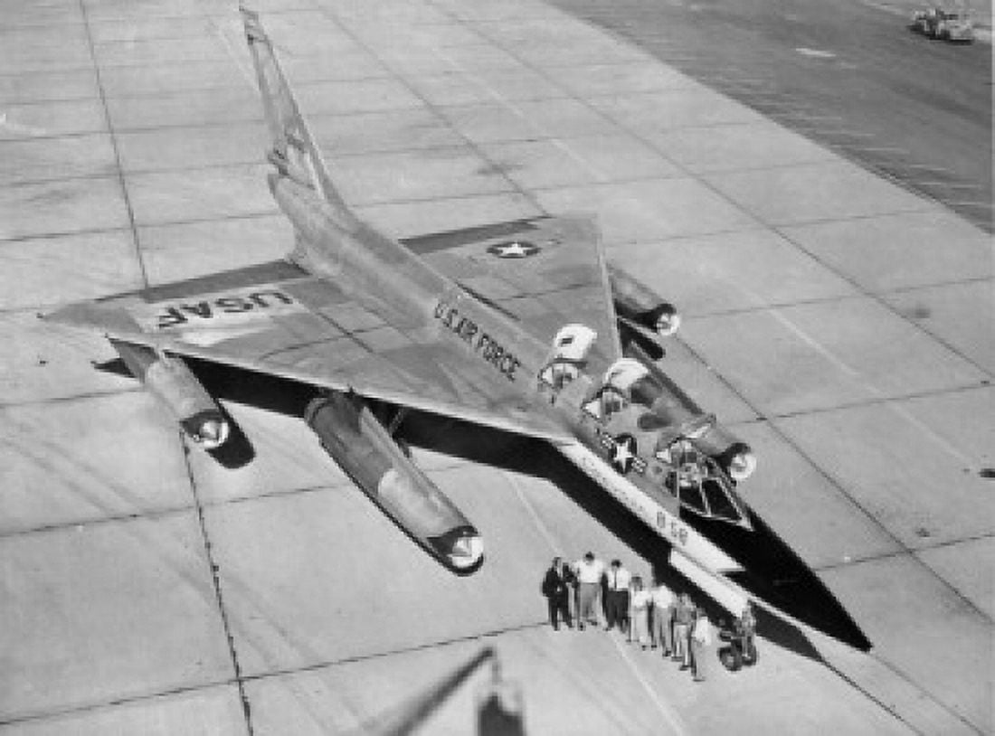 High angle view of a group of people standing near a fighter plane B-58 Hustler Canvas Art - (24 x 36)