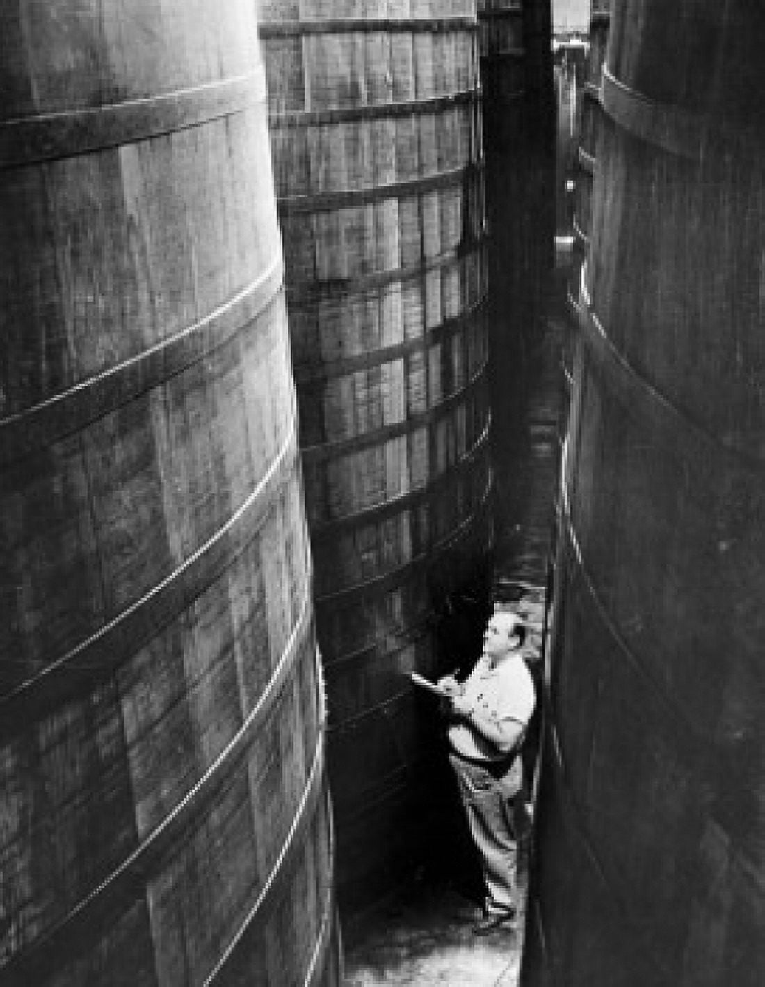 High angle view of a male worker standing in a storage room Canvas Art - (24 x 36)