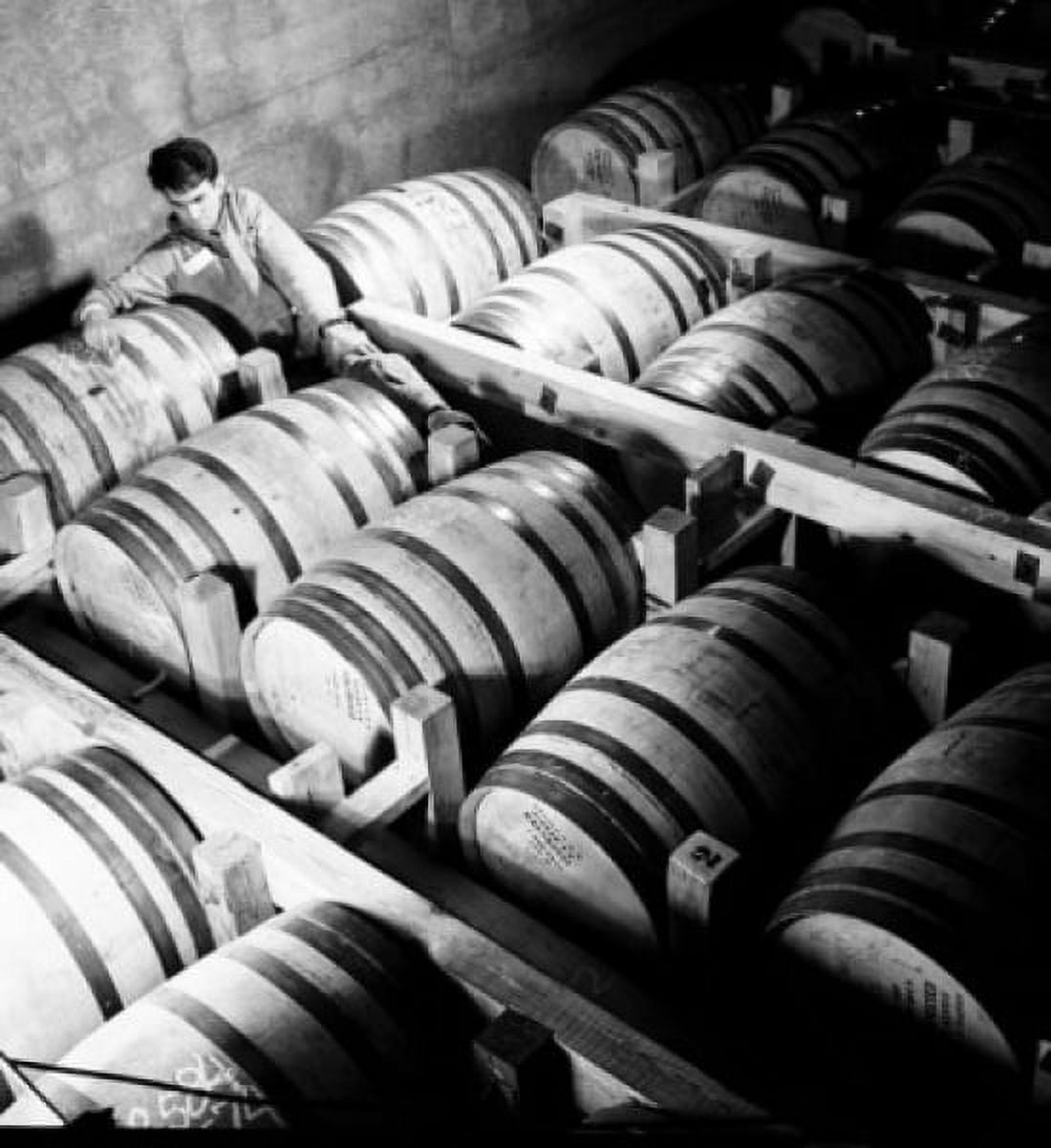 High angle view of a male worker writing on barrels in a distillery Louisville Kentucky USA Canvas Art -  (24 x 36)