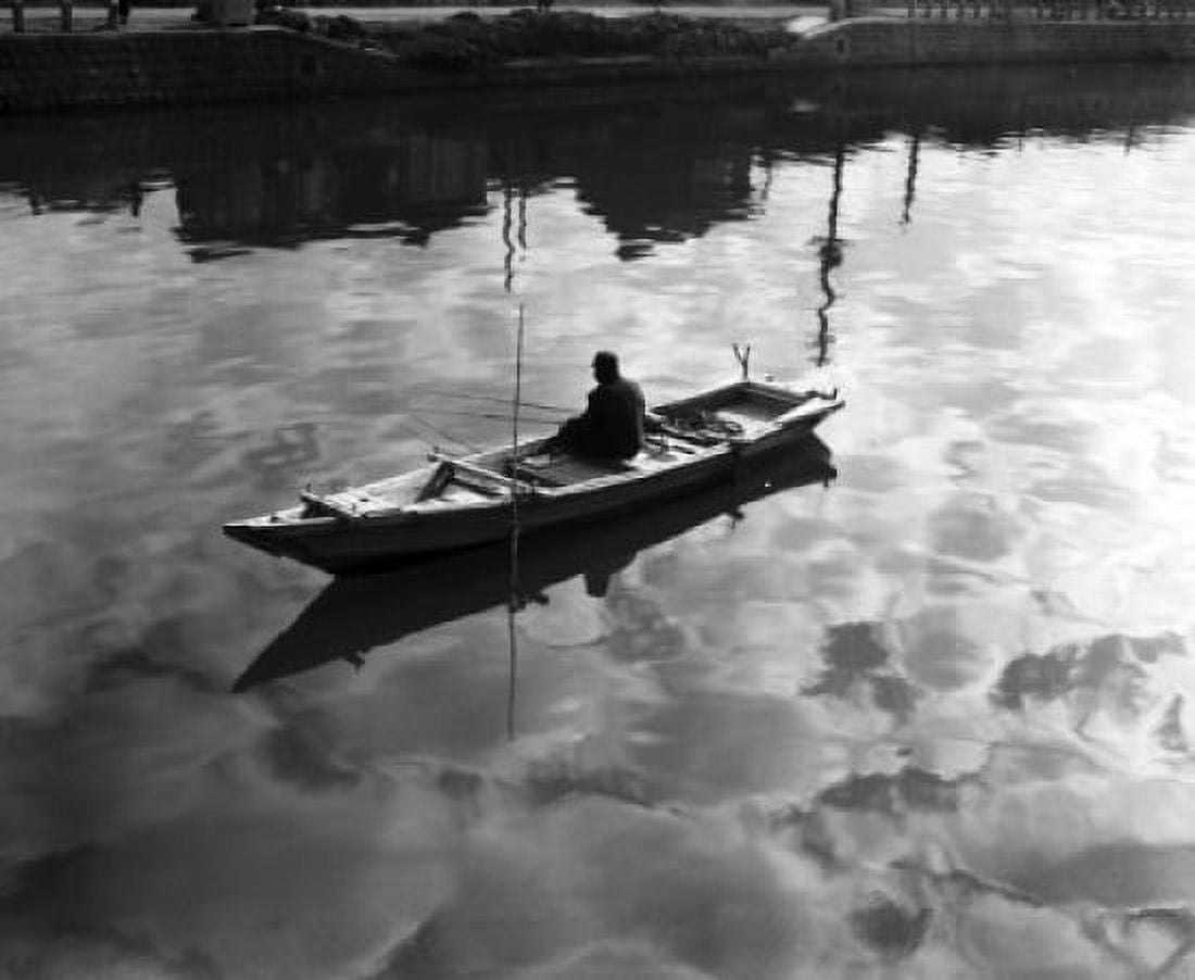 High angle view of a man sitting on a rowboat and fishing in a lake Canvas Art -  (18 x 24)