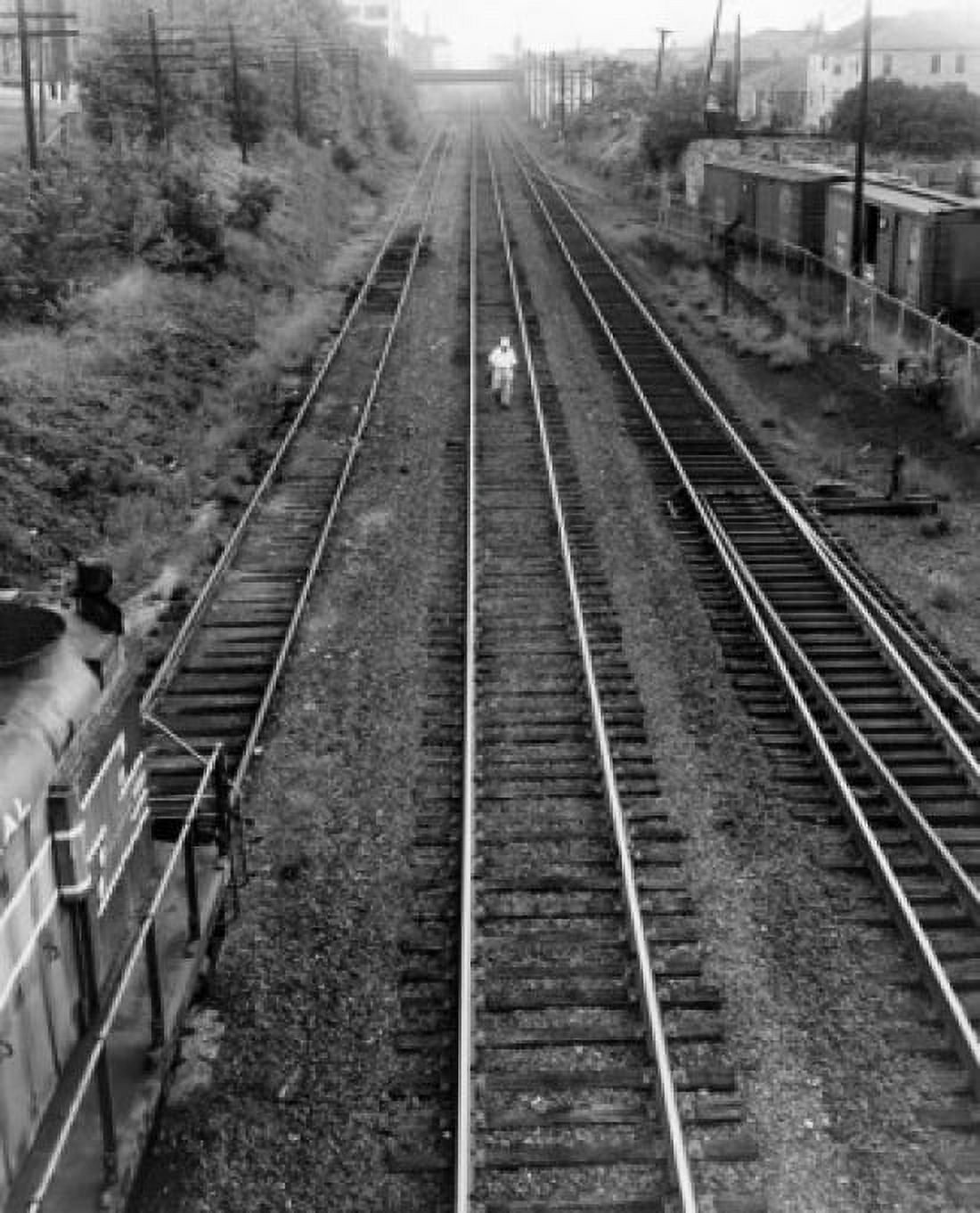 High angle view of a man walking on railroad tracks Canvas Art - (24 x 36)