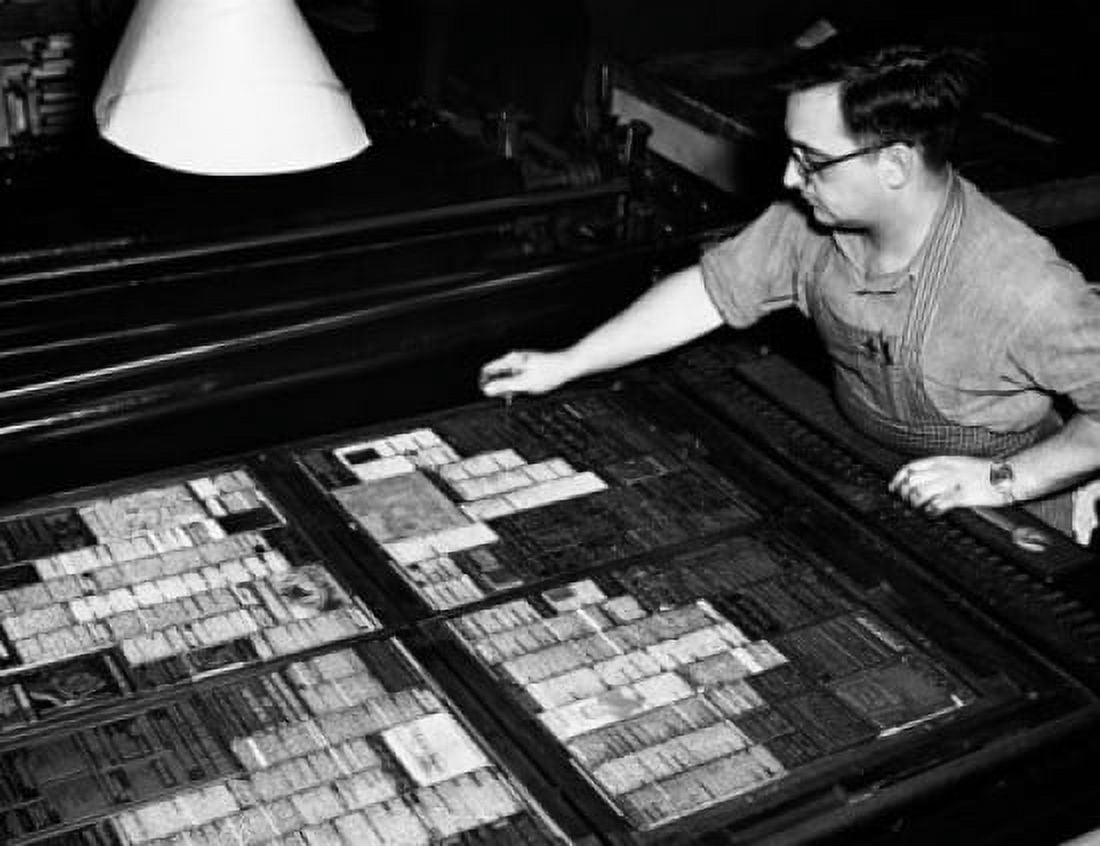 High angle view of a mature man working in a flatbed press Canvas Art - (24 x 36)