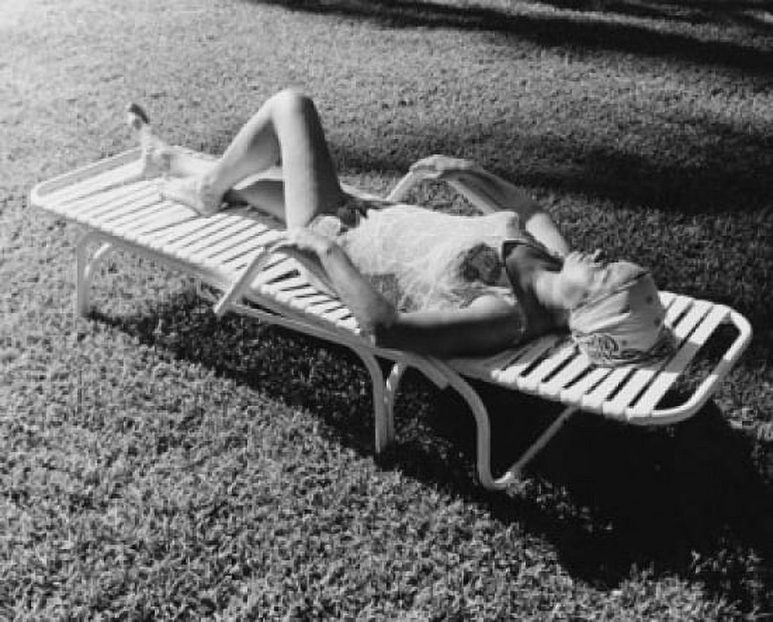 High angle view of a mature woman lying on a lounge chair Canvas Art - (18 x 24)