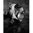 thumbnail image 1 of High angle view of a miner panning for gold Poster Print (24 x 36), 1 of 1