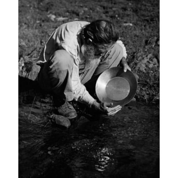 High angle view of a miner panning for gold Poster Print (24 x 36)