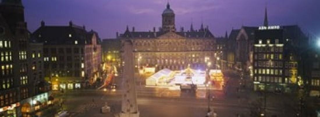 High angle view of a town square lit up at dusk Dam Square Amsterdam Netherlands Canvas Art - Panoramic Images (18 x 7)
