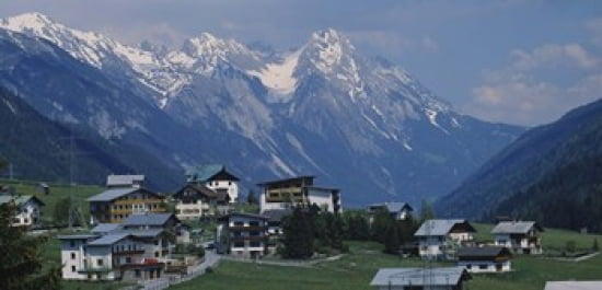 High angle view of a village on a landscape and a mountain range in the background St Anton Austria Canvas Art - Panoramic Images (24 x 12)