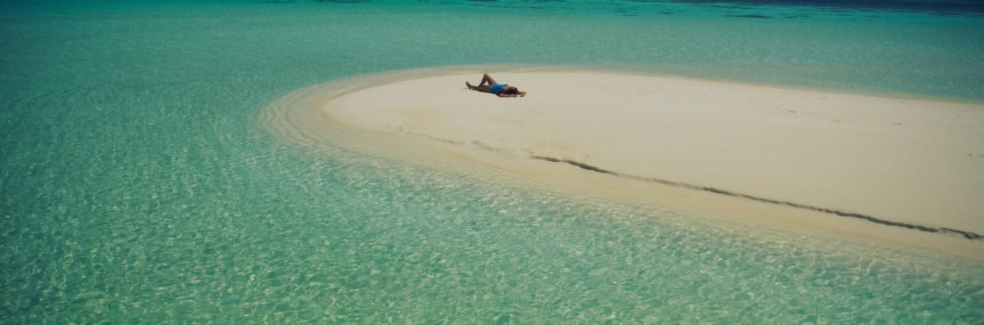 High angle view of a woman sunbathing on the beach Maldives Canvas Art - Panoramic Images (27 x 9)