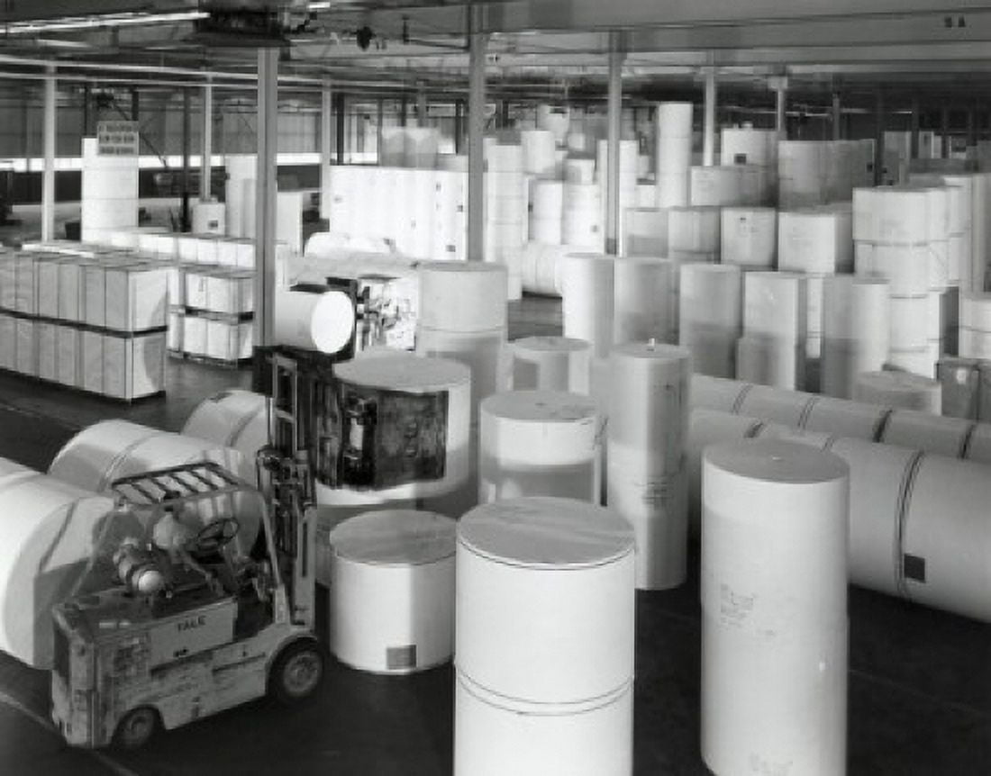 High angle view of a worker driving forklift in a paper warehouse Canvas Art - (24 x 36)