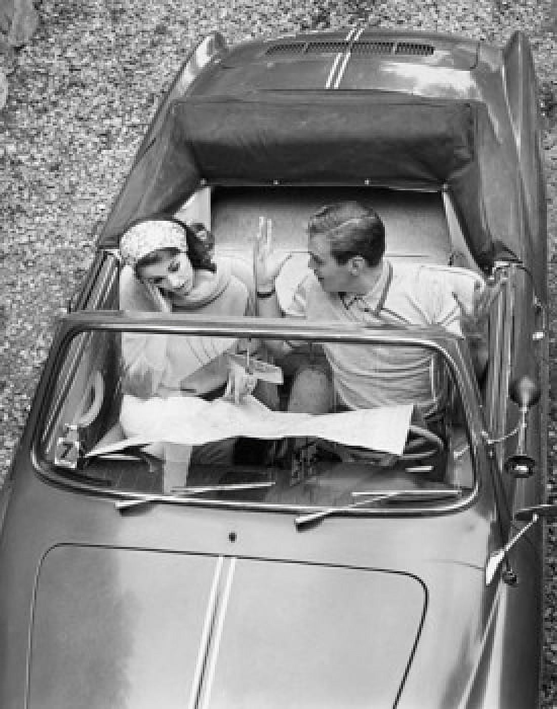 High angle view of a young couple sitting in a car and reading a map Canvas Art - (18 x 24)