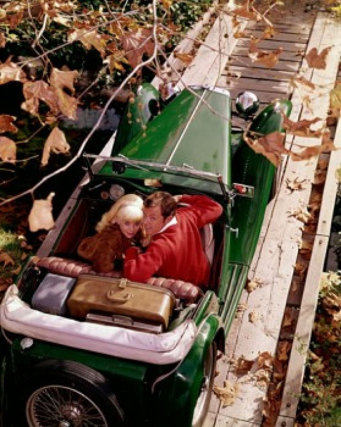 High angle view of a young couple sitting in a convertible car Canvas Art - (18 x 24)