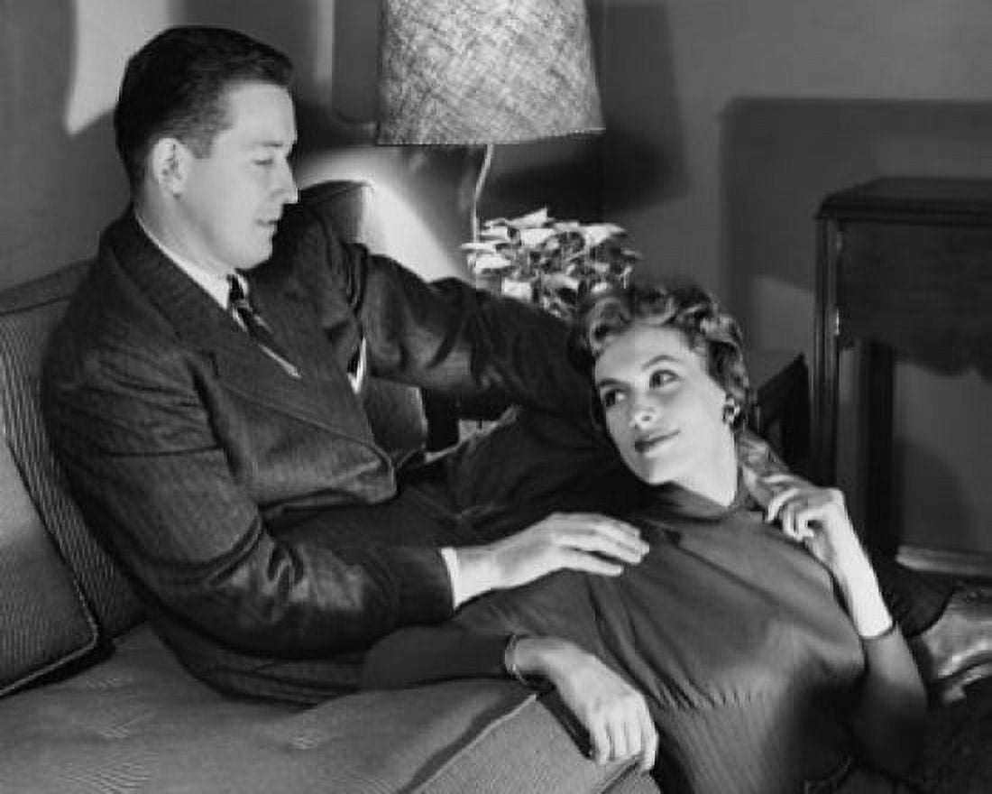 High angle view of a young couple sitting in a living room Canvas Art - (24 x 36)