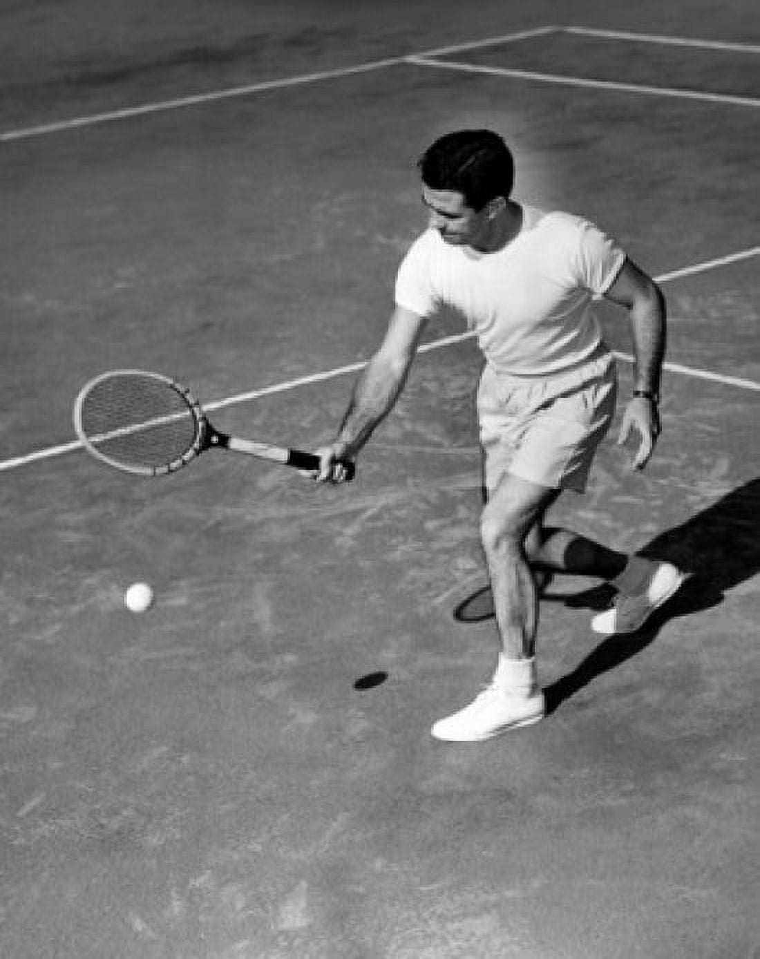 High angle view of a young man playing tennis on a tennis court Canvas Art - (18 x 24)