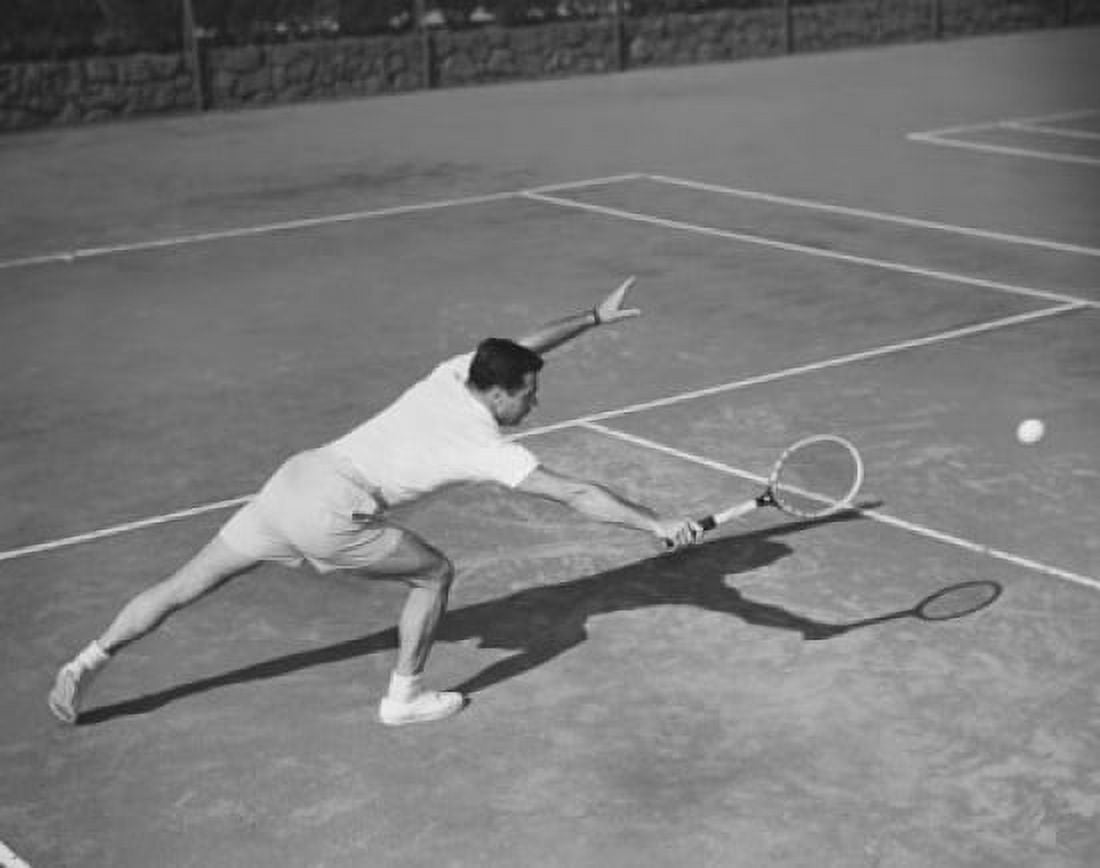 High angle view of a young man playing tennis on a tennis court Canvas Art - (24 x 36)