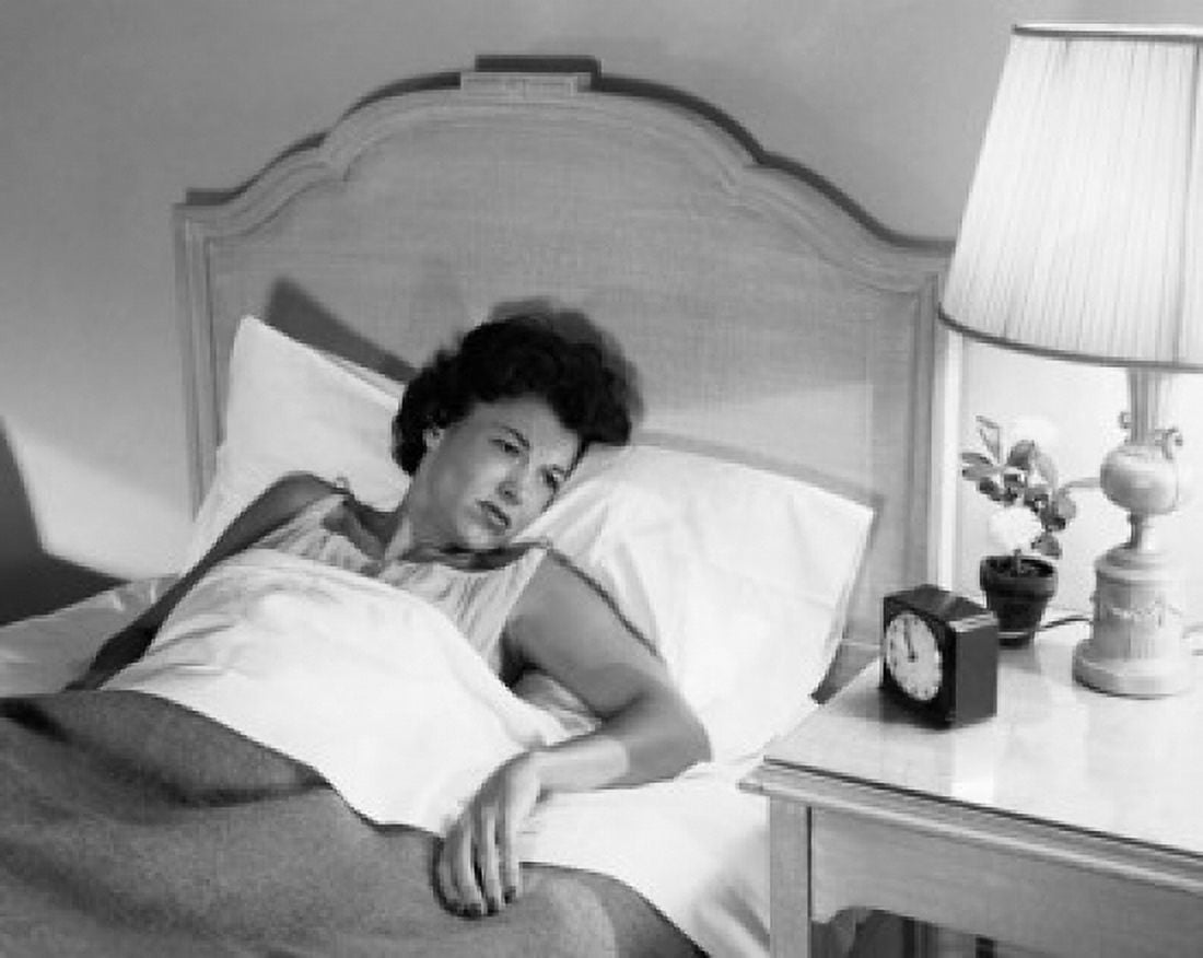 High angle view of a young woman lying in the bed Canvas Art - (24 x 36)