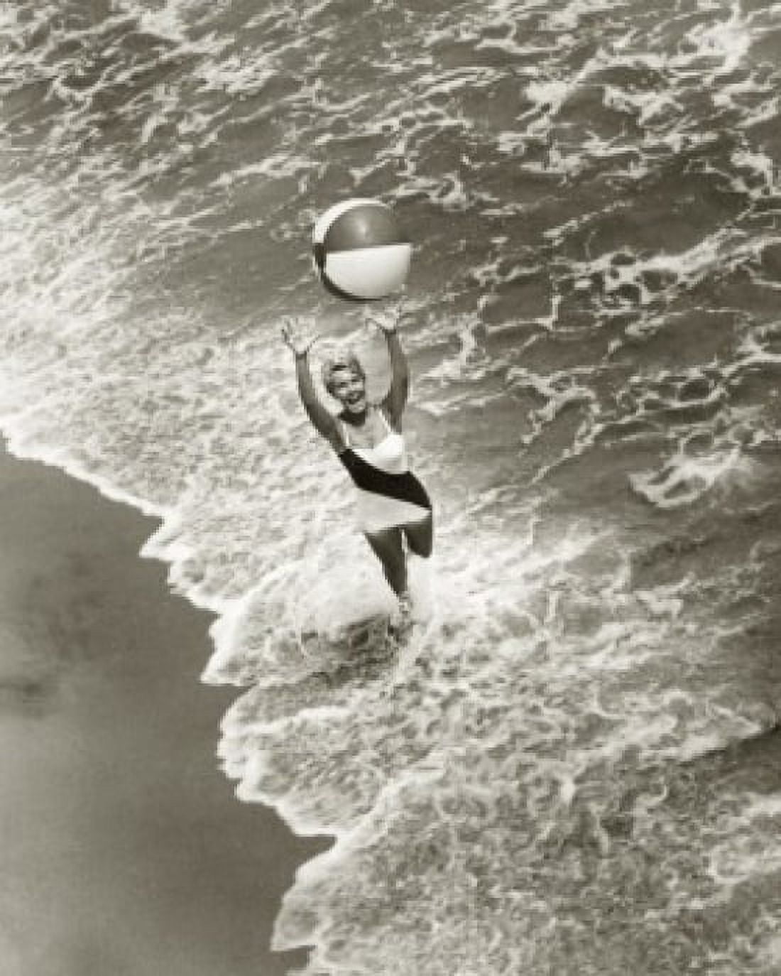 High angle view of a young woman playing with a beach ball on the beach Canvas Art - (18 x 24)