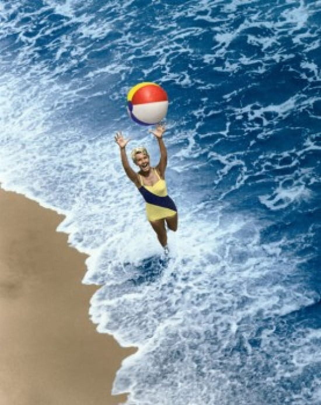 High angle view of a young woman playing with a beach ball on the beach Canvas Art - (18 x 24)