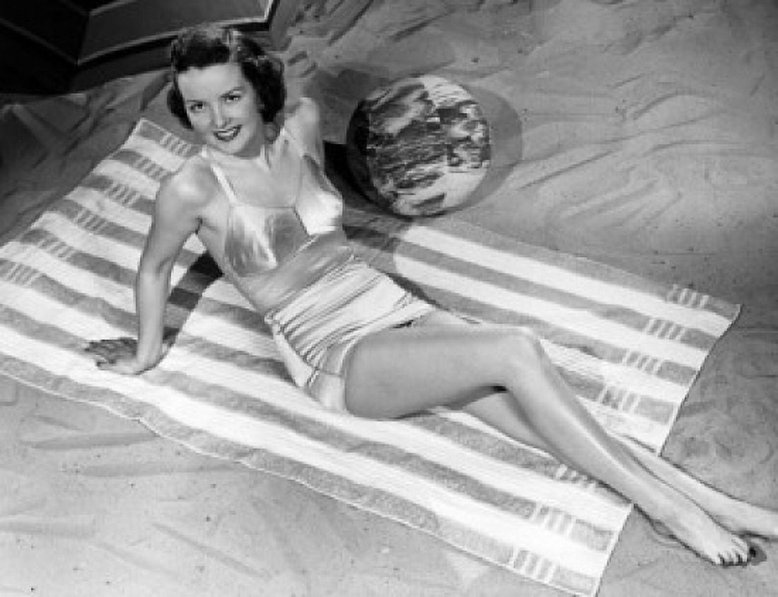 High angle view of a young woman reclining on the beach Canvas Art - (18 x 24)