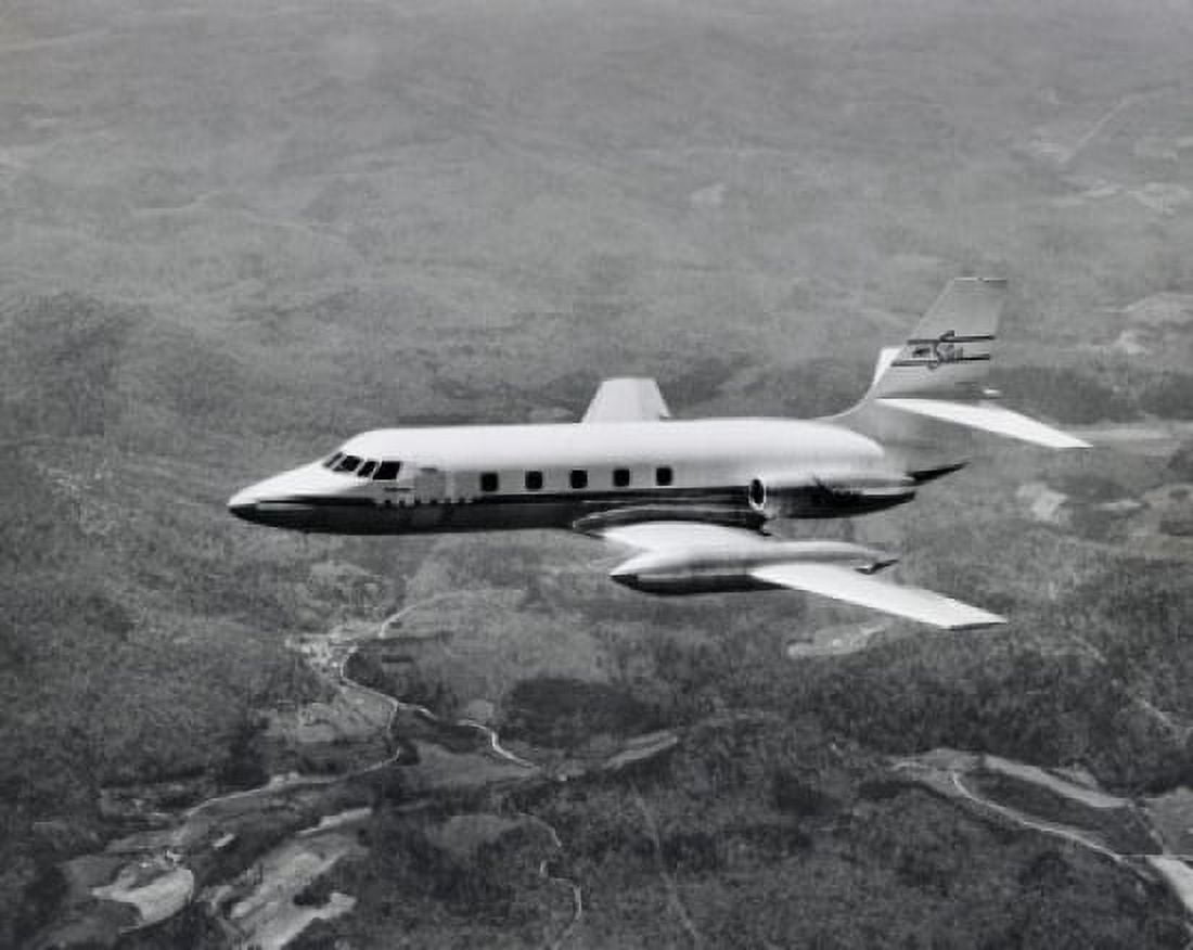 High angle view of an aircraft in flight Lockheed JetStar Canvas Art - (18 x 24)