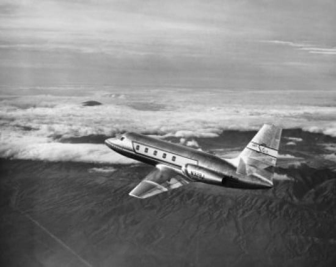 High angle view of an aircraft in flight Lockheed JetStar Canvas Art - (24 x 36)
