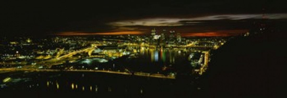 High angle view of buildings lit up at dawn Pittsburgh Pennsylvania USA Canvas Art - Panoramic Images (18 x 7)