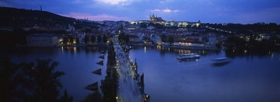 High angle view of buildings lit up at dusk Charles Bridge Vltava River Prague Czech Republic Canvas Art - Panoramic Images (36 x 13)