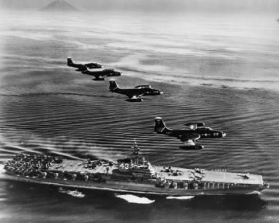 High angle view of four fighter planes flying over an aircraft carrier US Navy Banshees USS Coral Sea (CV-43) Canvas Art -  (18 x 24)