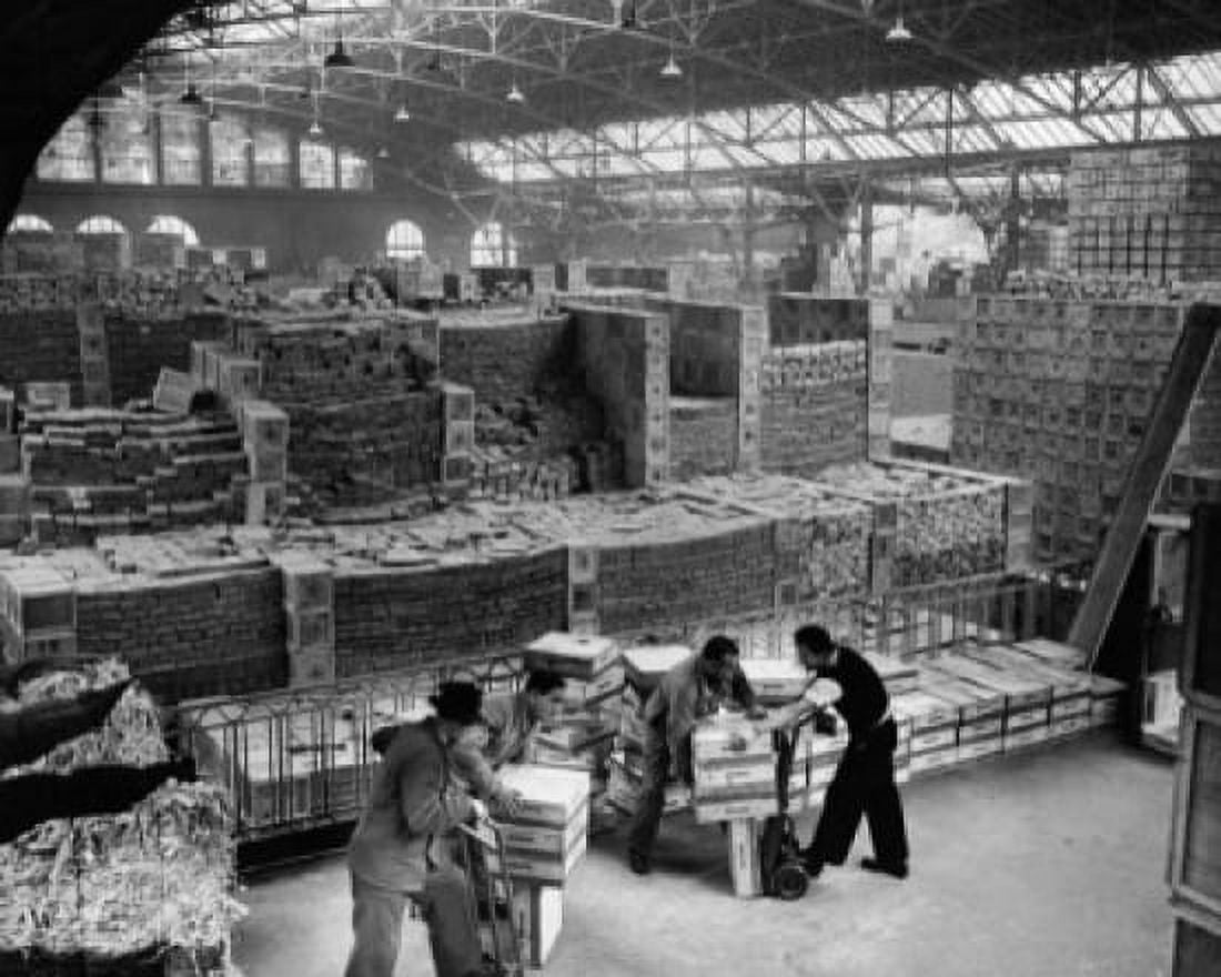 High angle view of four workers in a warehouse Canvas Art - (24 x 36)