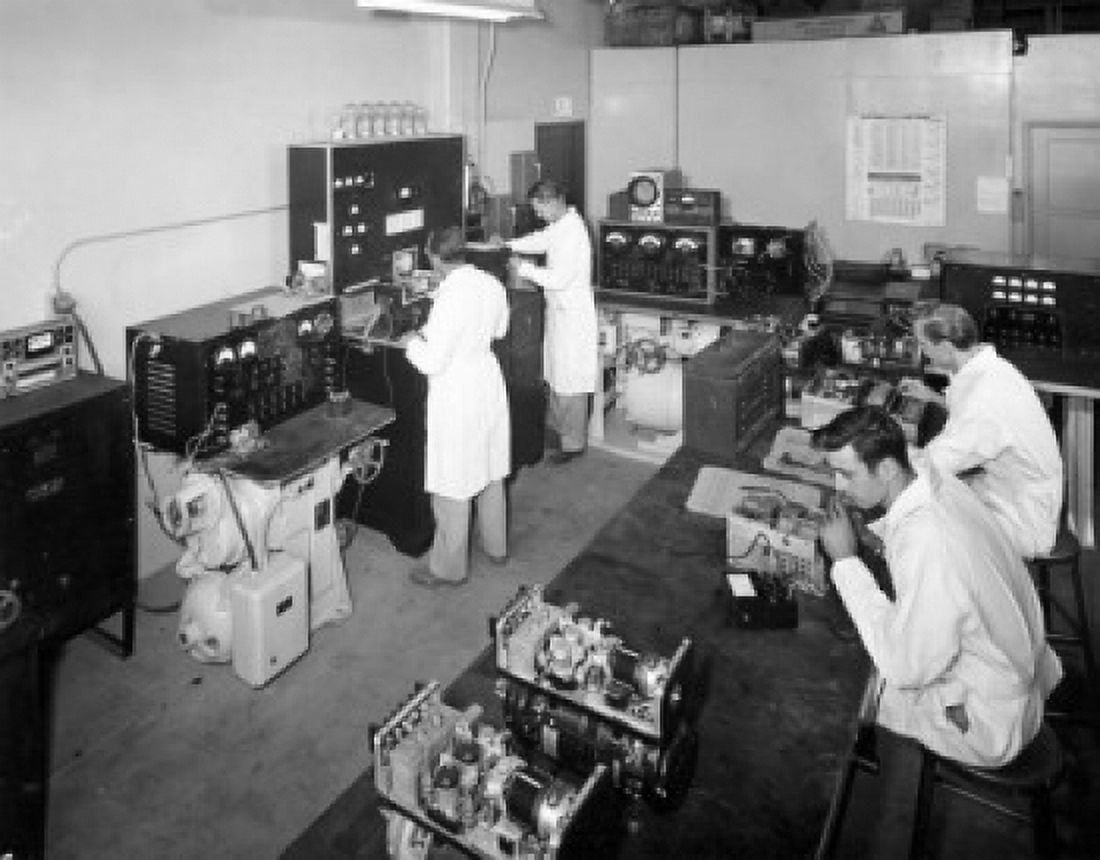 High angle view of male engineers testing electronic components Canvas Art - (24 x 36)