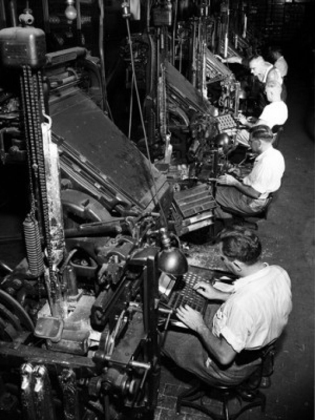 High angle view of male workers operating linotype machines Canvas Art - (18 x 24)