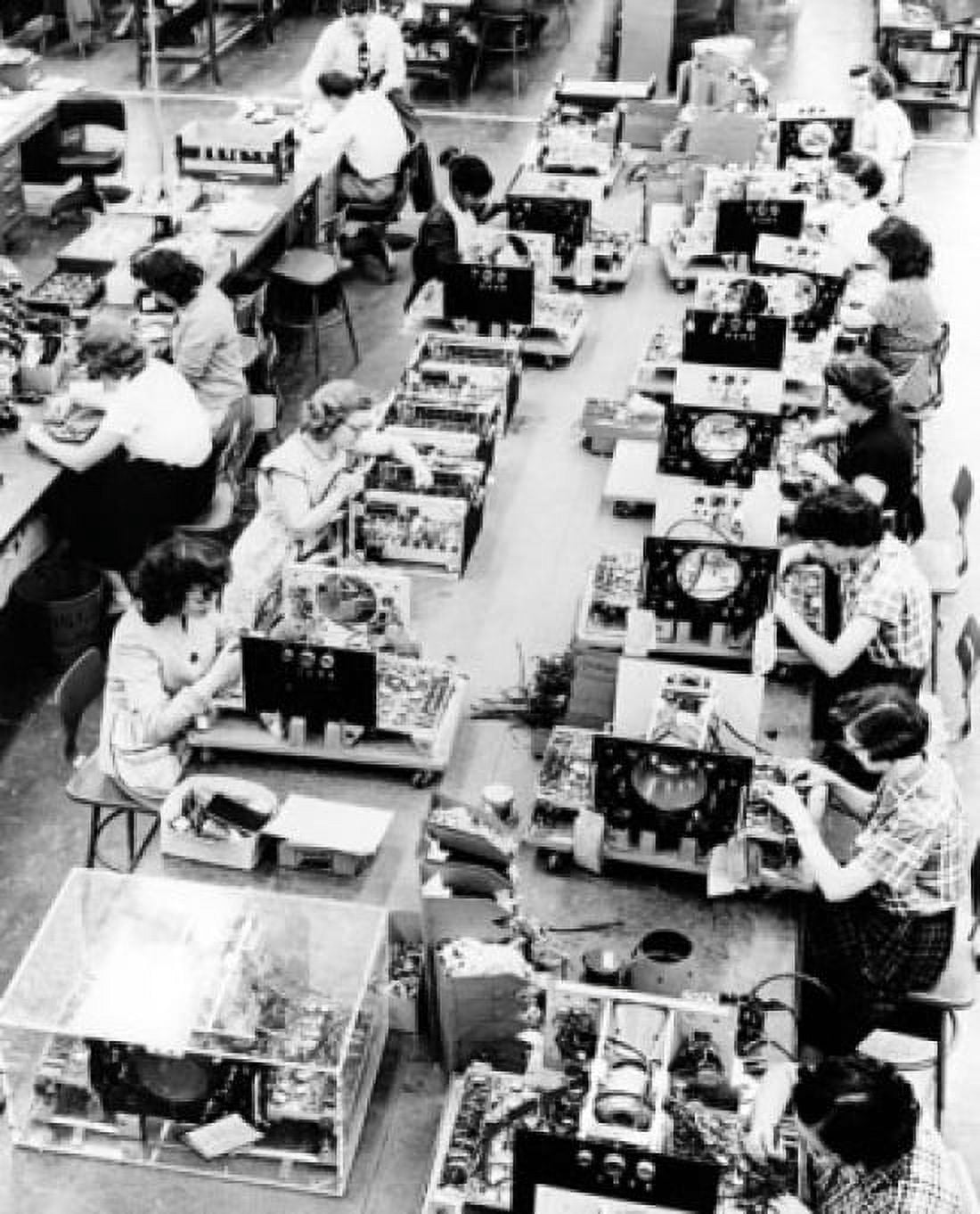 High angle view of manual workers assembling indicators for airborne radar Canvas Art - (24 x 36)