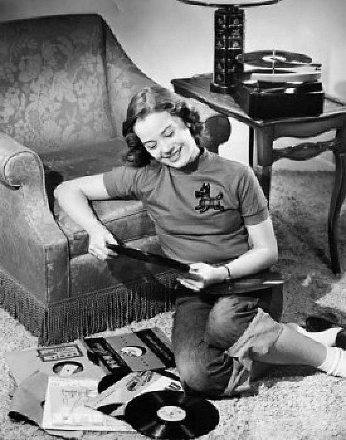 High angle view of smiling teenage girl holding record Canvas Art - (18 x 24)