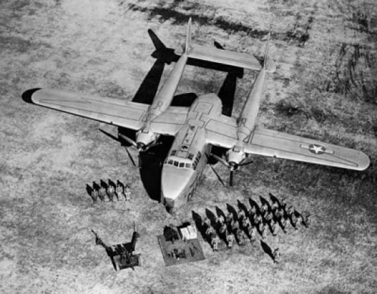 High angle view of soldiers standing near a military airplane Fairchild C-119 Flying Boxcar Canvas Art - (18 x 24)