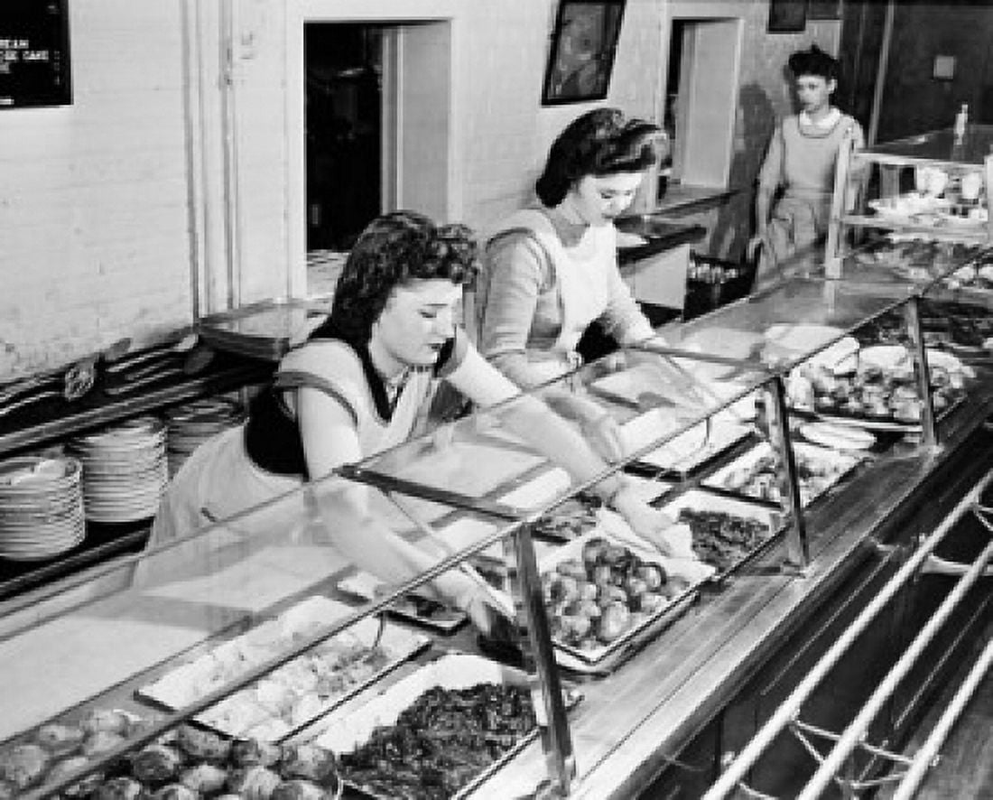 High angle view of three Home Economics Students serving food in a cafeteria Hyattsville Maryland USA Canvas Art - (24 x 36)
