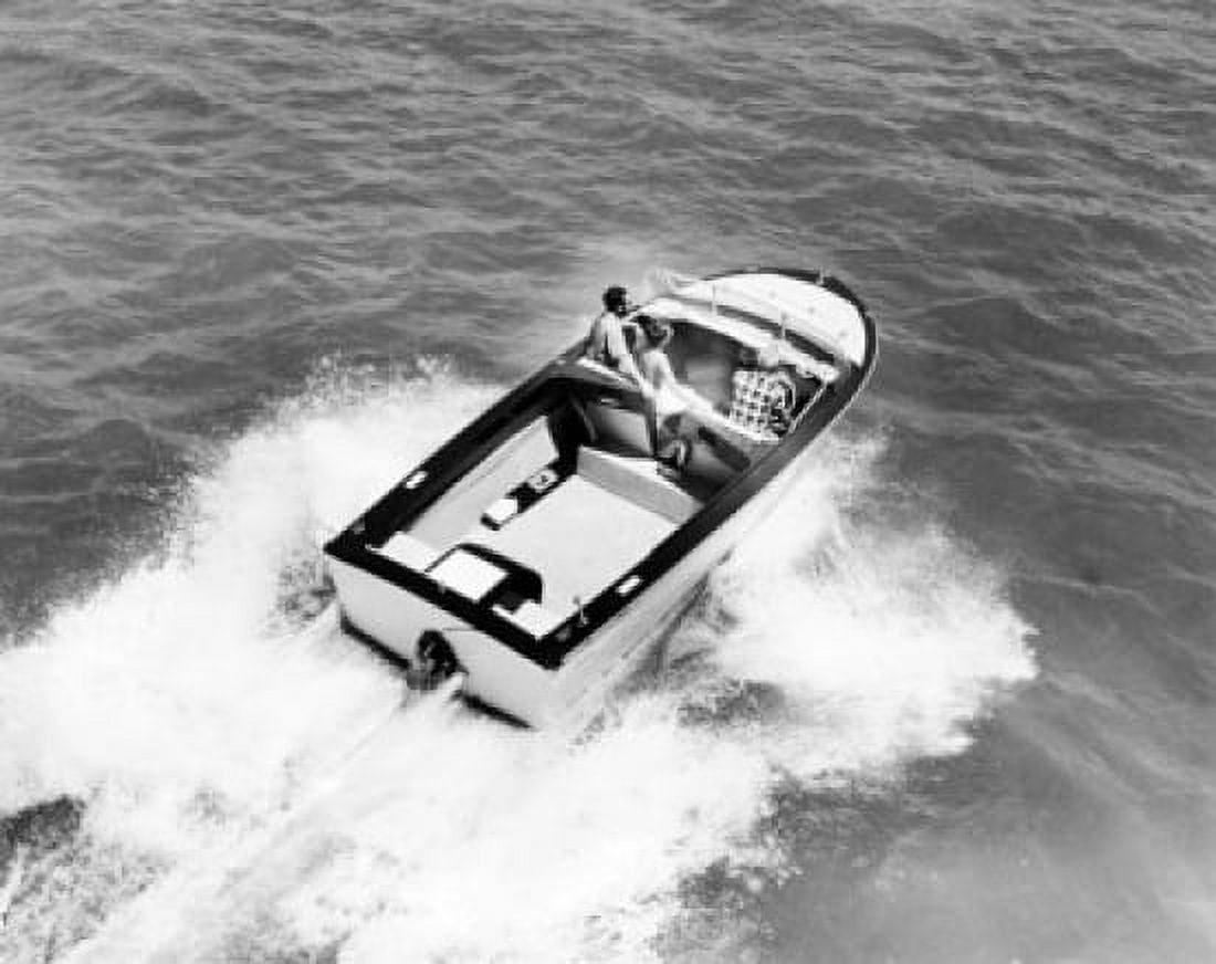 High angle view of three people in a motorboat Canvas Art - (18 x 24)