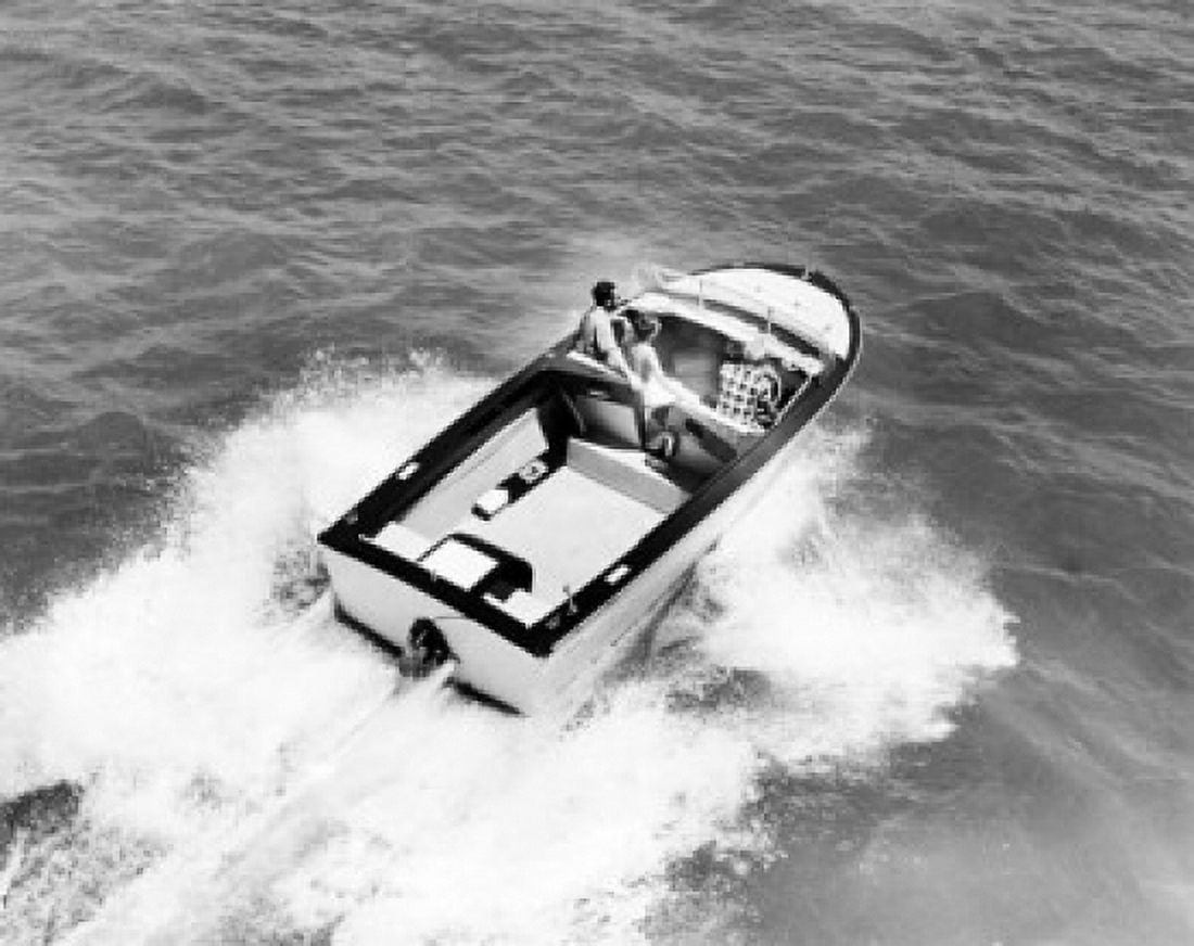 High angle view of three people in a motorboat Canvas Art - (24 x 36)