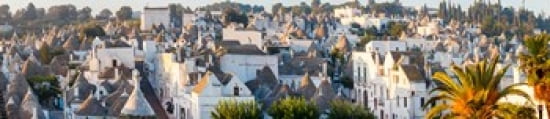 High angle view of trulli houses in town of Alberobello Bari Province Puglia Italy Canvas Art - Panoramic Images (22 x 5)