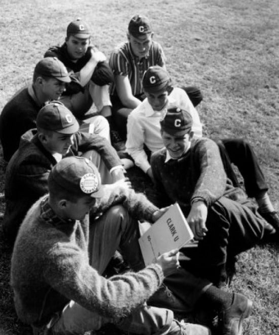 High angle view of young men sitting on a lawn Canvas Art - (18 x 24)
