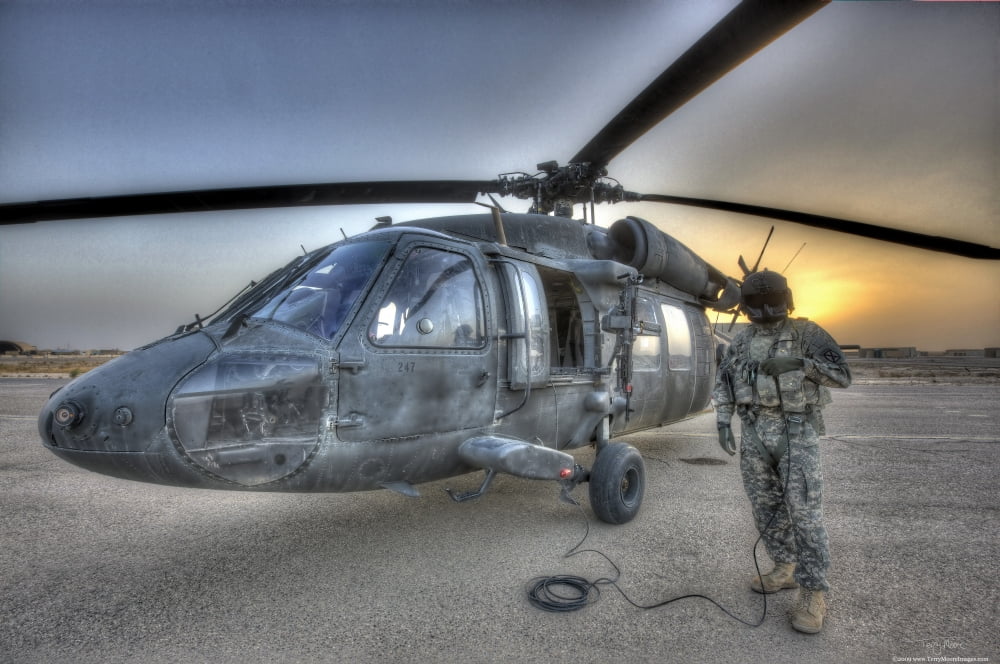 High dynamic range image of a door gunner beside a UH-60 Black Hawk Canvas Art - Terry MooreStocktrek Images (18 x 12)