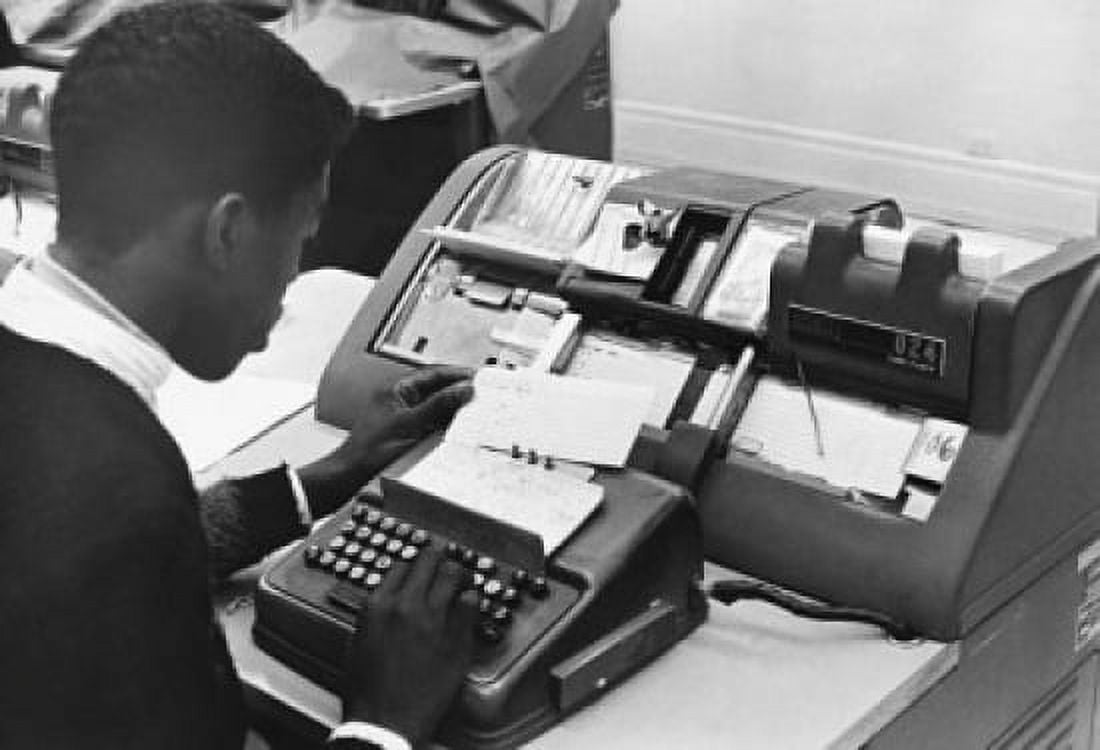 High school student learning to operate a keypunch machine Canvas Art - (18 x 24)