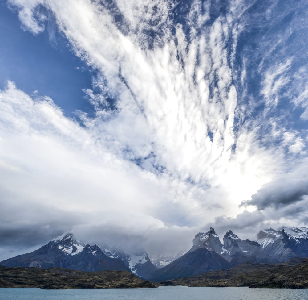 High storm clouds fill the sky above the mountains Lake Pehoe Torres Del Paine National Park Chile Canvas Art - Panoramic Images (24 x 24)