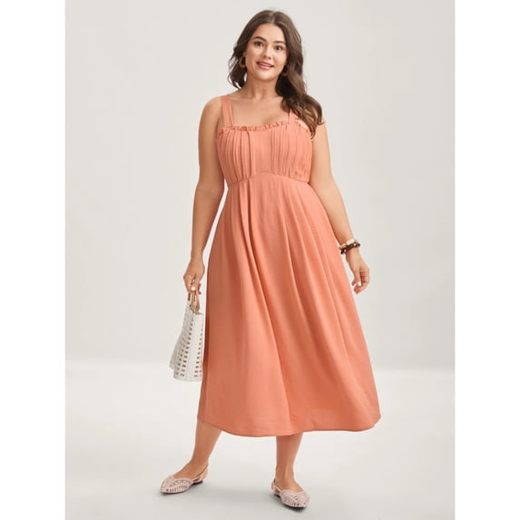 High-waisted, full-skirted, midi dress with pleated pockets, perfect for a vacation.