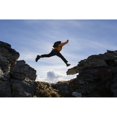 thumbnail image 1 of Hiker Leaps Between Rocks Near Noatak River In The Brooks Range Gates Of The, 1 of 3