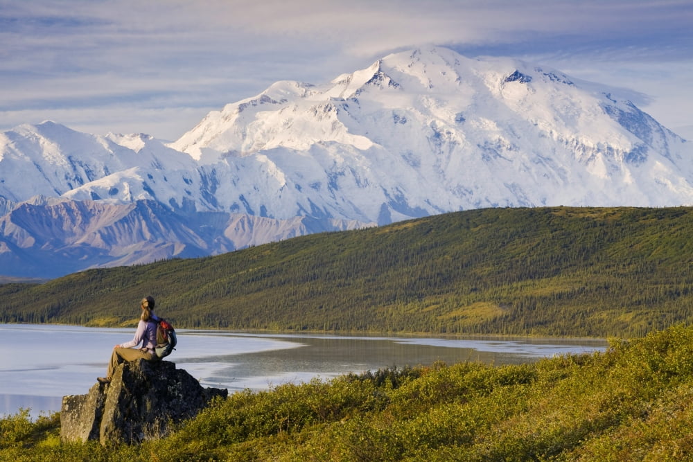 Hiker Sits And Enjoys A View Of Wonder Lake And Mt Mckinley During Late Summer In Interior Alaska Canvas Art - Michael DeYoung Design Pics (34 x 22)