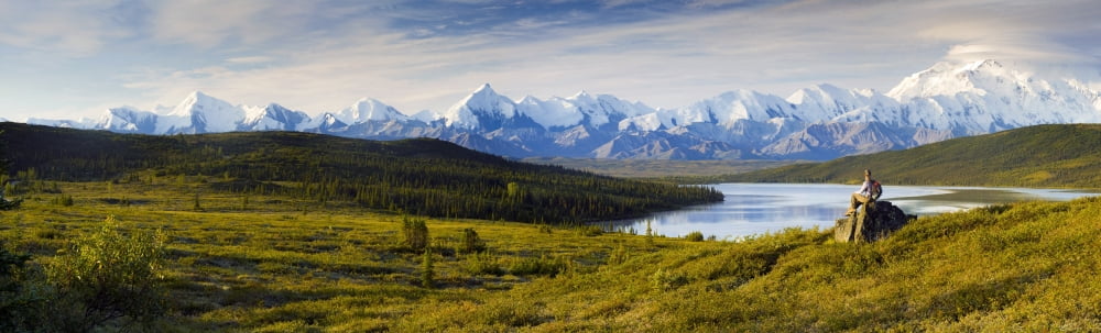 Hiker Sits And Enjoys A View Of Wonder Lake And Mt Mckinley During Late Summer In Interior Alaska Canvas Art - Michael DeYoung Design Pics (39 x 11)