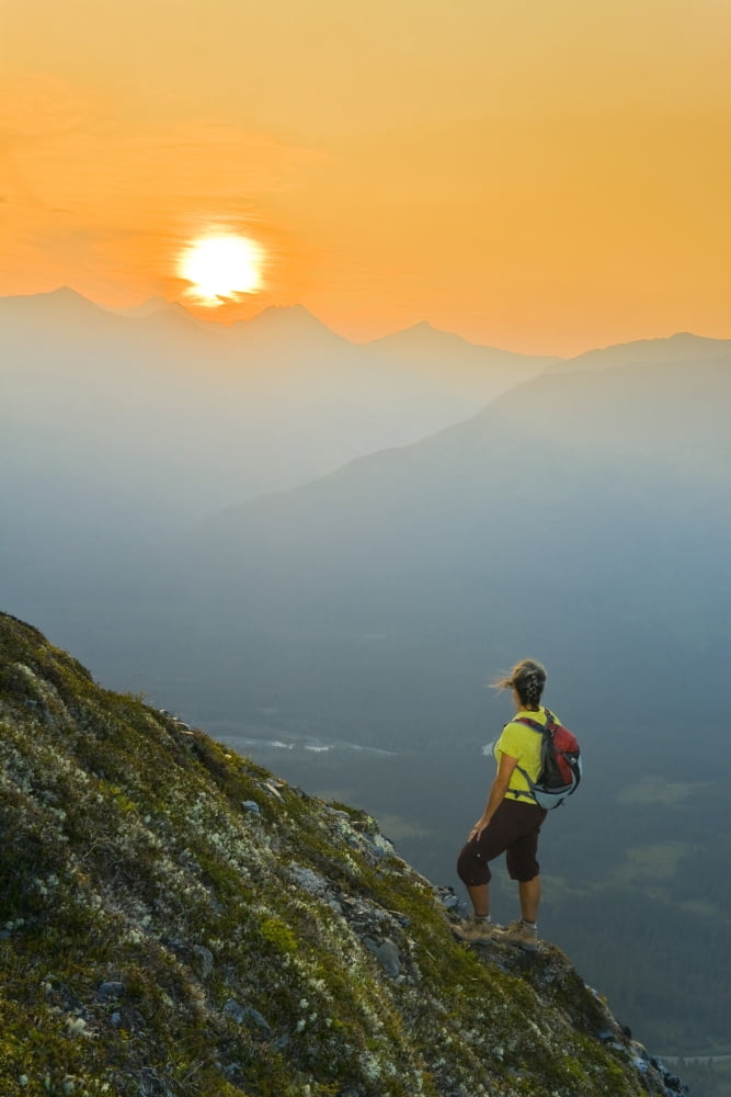 Hiker On The Steep Hillside Of Mt Alyeska Watching The Sun Set Over Girdwood Valley In Southcentral Alaska Canvas Art - Michael DeYoung Design Pics (11 x 17)