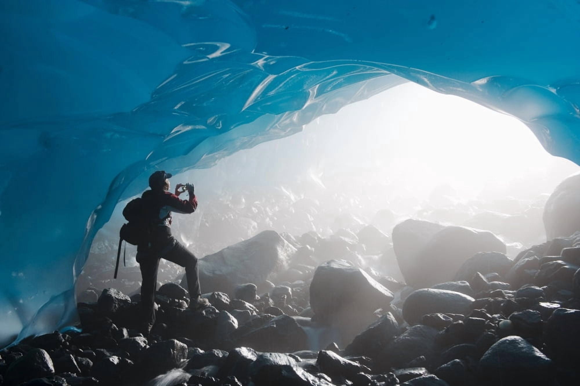 A Hiker Takes A Photograph Of The Entrance Of An Ice Cave From The Inside Of The Mendenhall Glacier Juneau Southeast Alaska Summer Canvas Art - Chris Miller Design Pics (34 x 22)