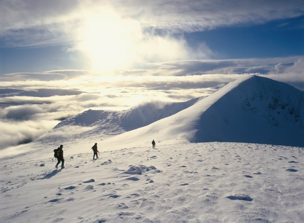 Hikers On A Mountaintop In The Snow Canvas Art - Ian Cumming Design Pics (36 x 26)